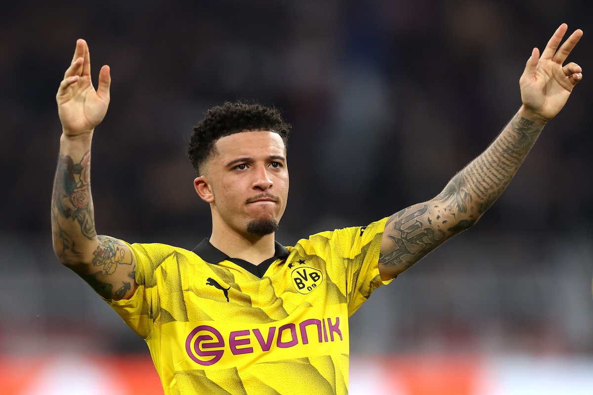 Jadon Sancho celebrates with fans after Dortmund reach the Champions League final.