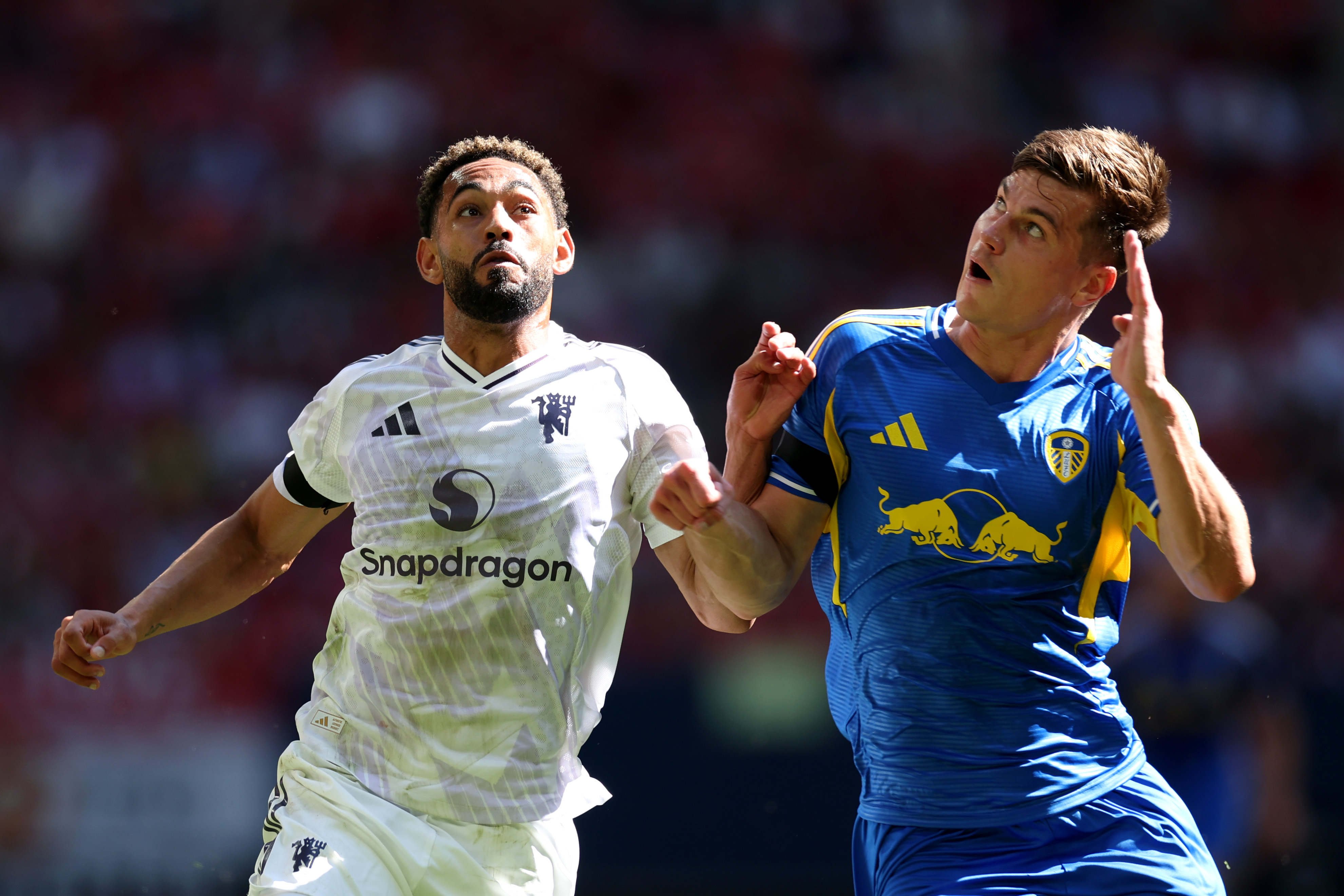 Matheus Cunha vies for an aerial duel with Jaka Bijol of Leeds United.