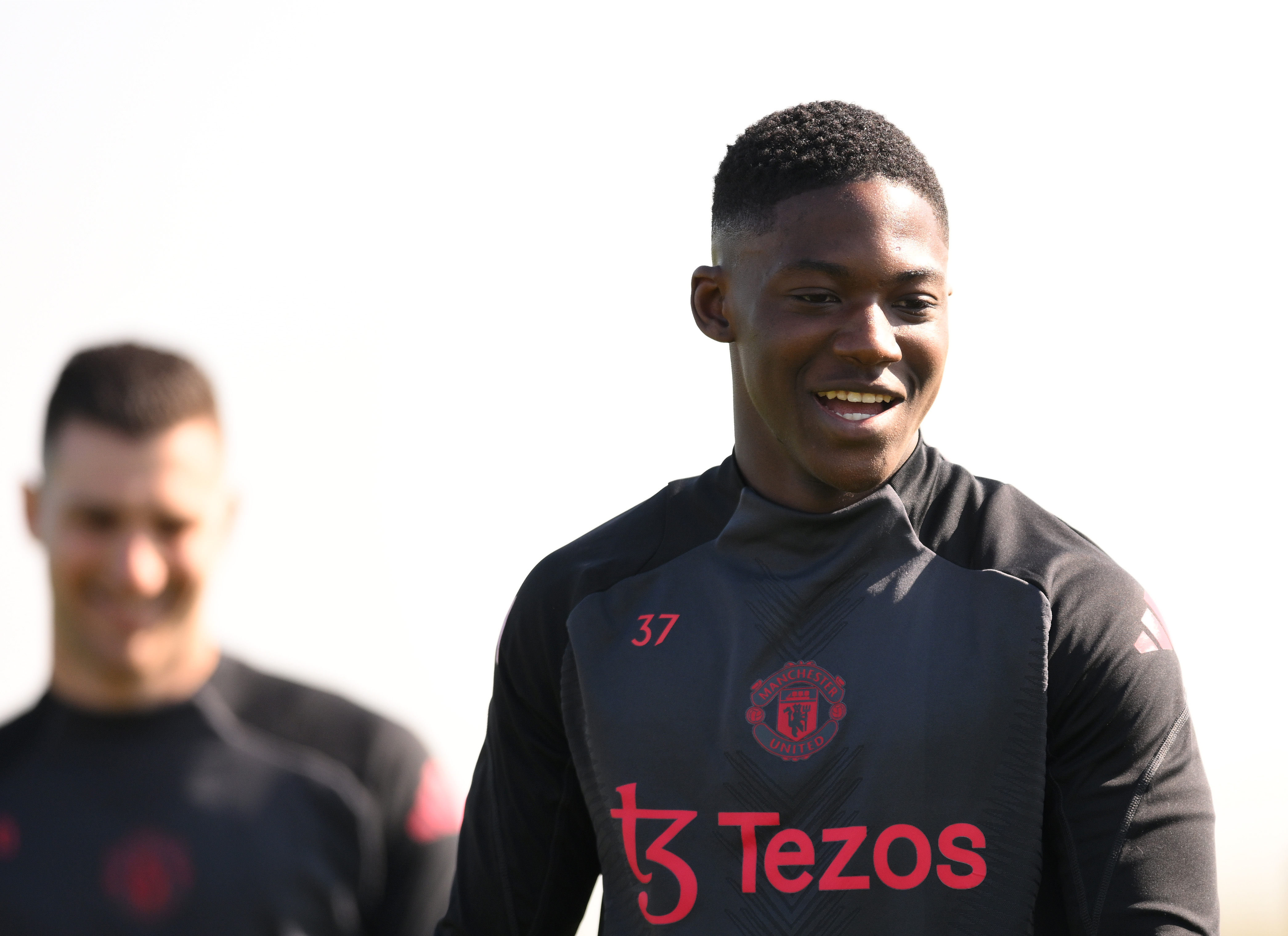 Kobbie Mainoo all smiles while training at Carrington
