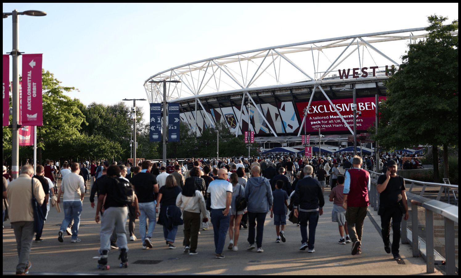 West Ham fans arrive at the London Stadium before the side face Chelsea.