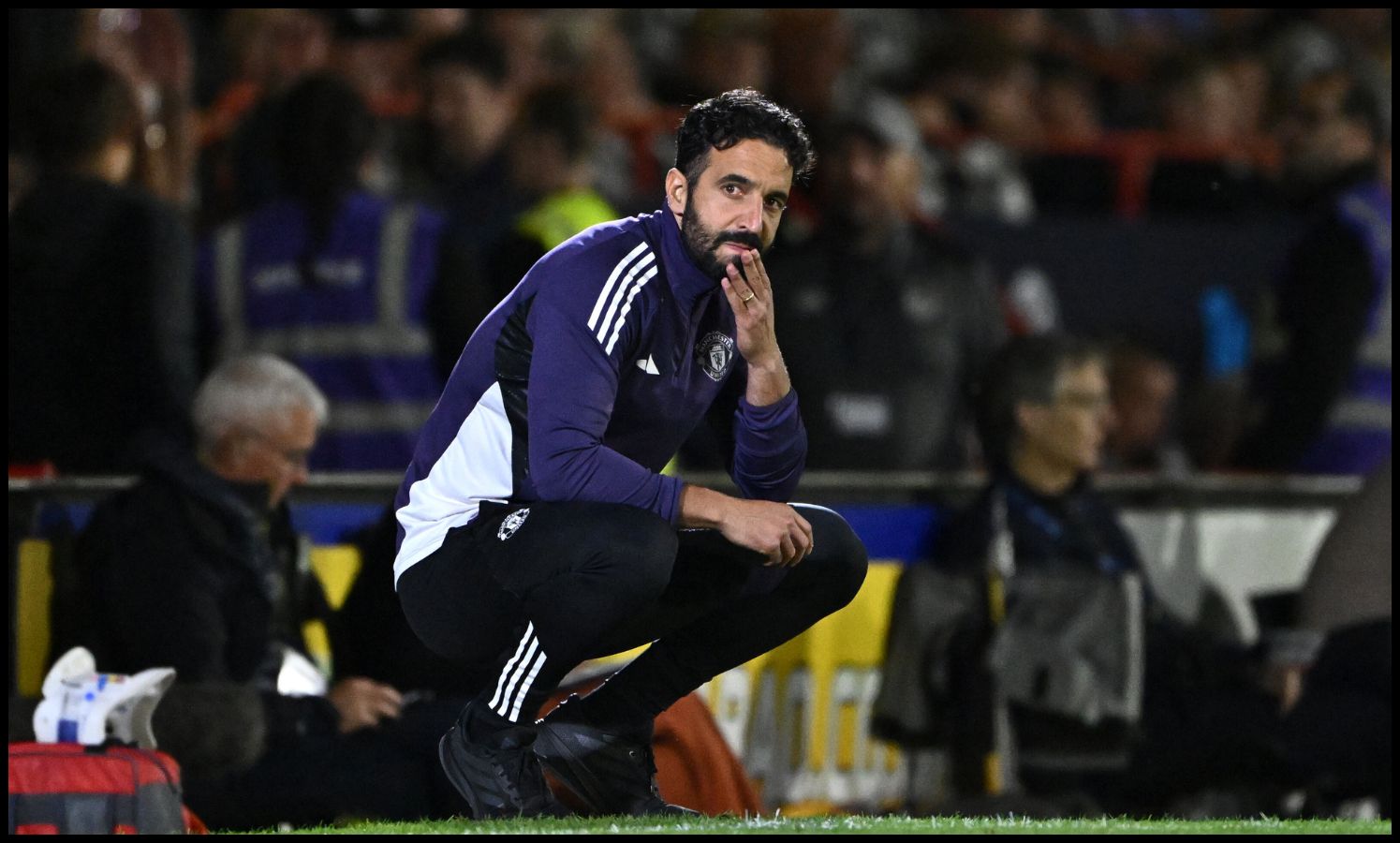 Ruben Amorim looks on from the touchline.
