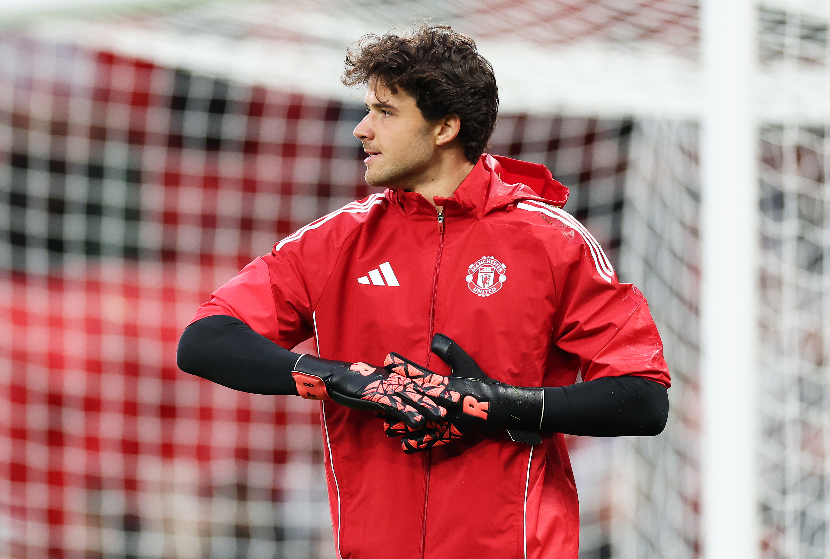 Senne Lammens warms up at Old Trafford ahead of Man United vs Chelsea.
