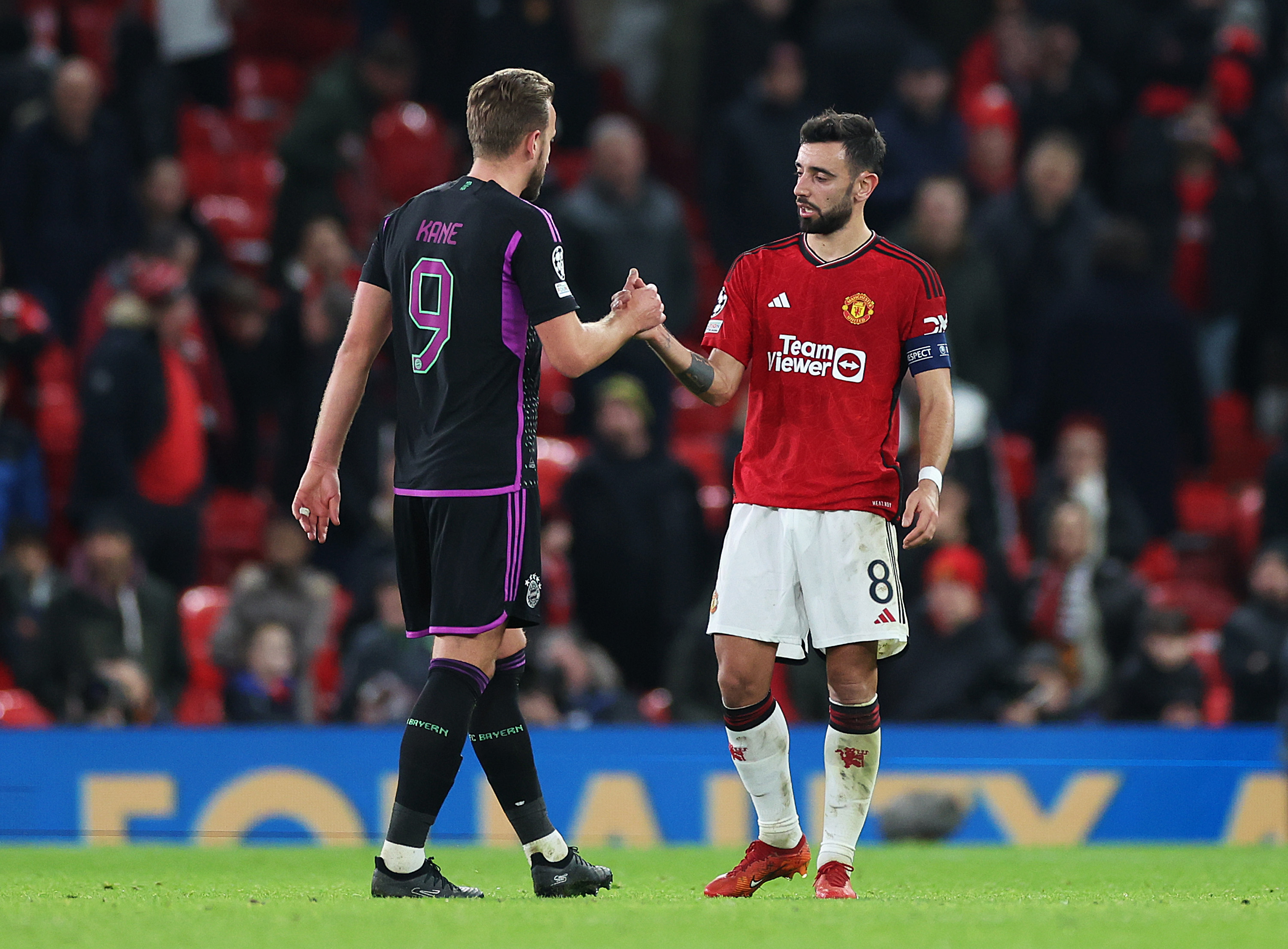 Bruno Fernandes and Harry Kane shake hands at full-time between Bayern and Man United.