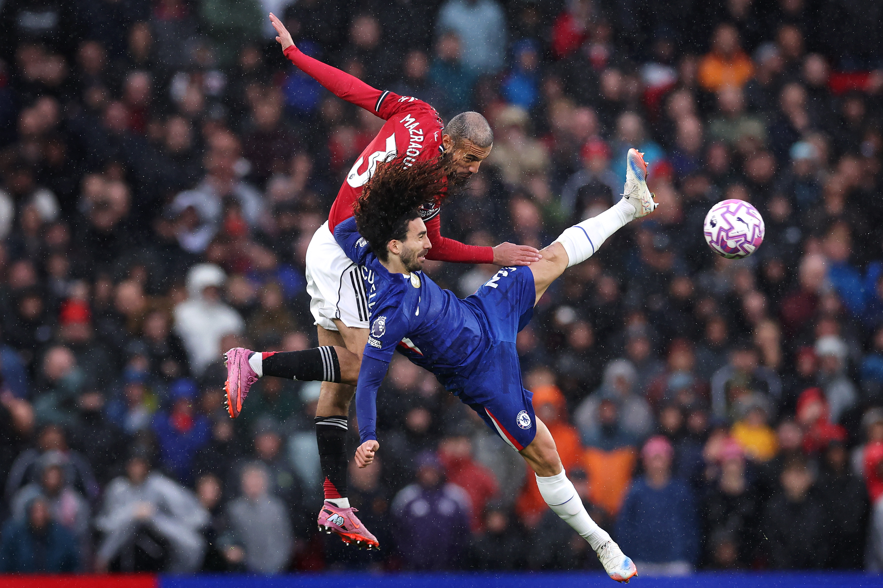 Noussair Mazraoui vies with Marc Cucurella.