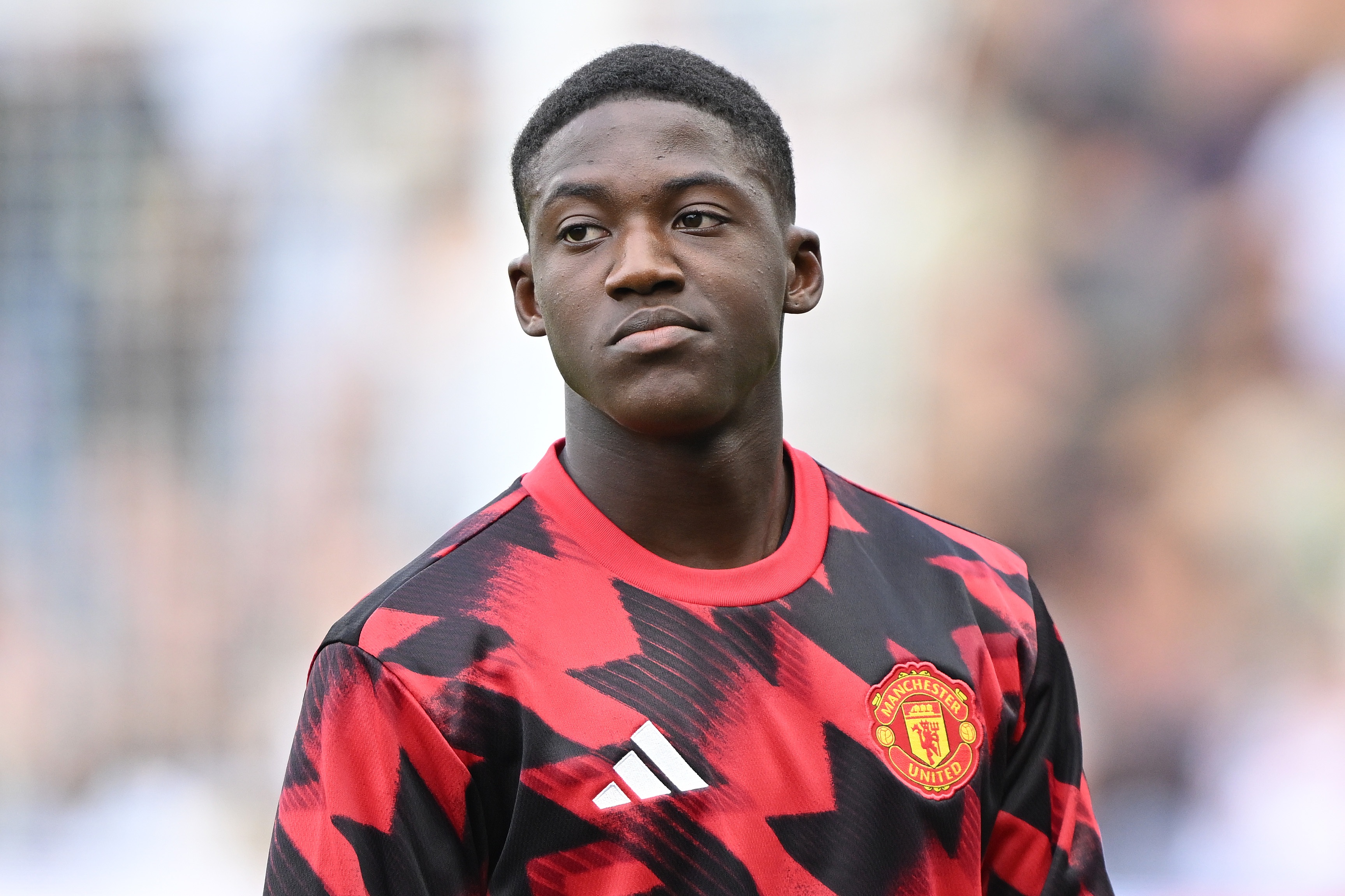 Kobbie Mainoo looks glum-faced during Manchester United game.