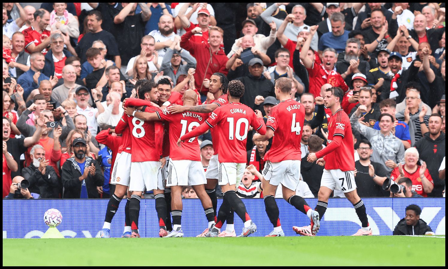 Man United players celebrate Josh Cullen’s own-goal.