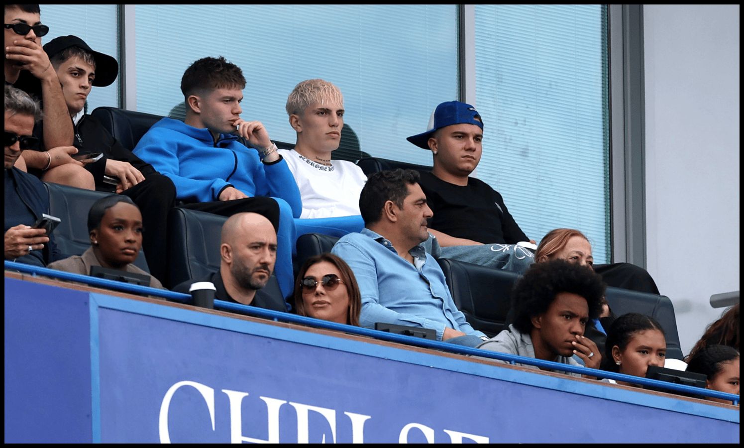 Alejandro Garnacho watches on from the stands at Stamford Bridge.
