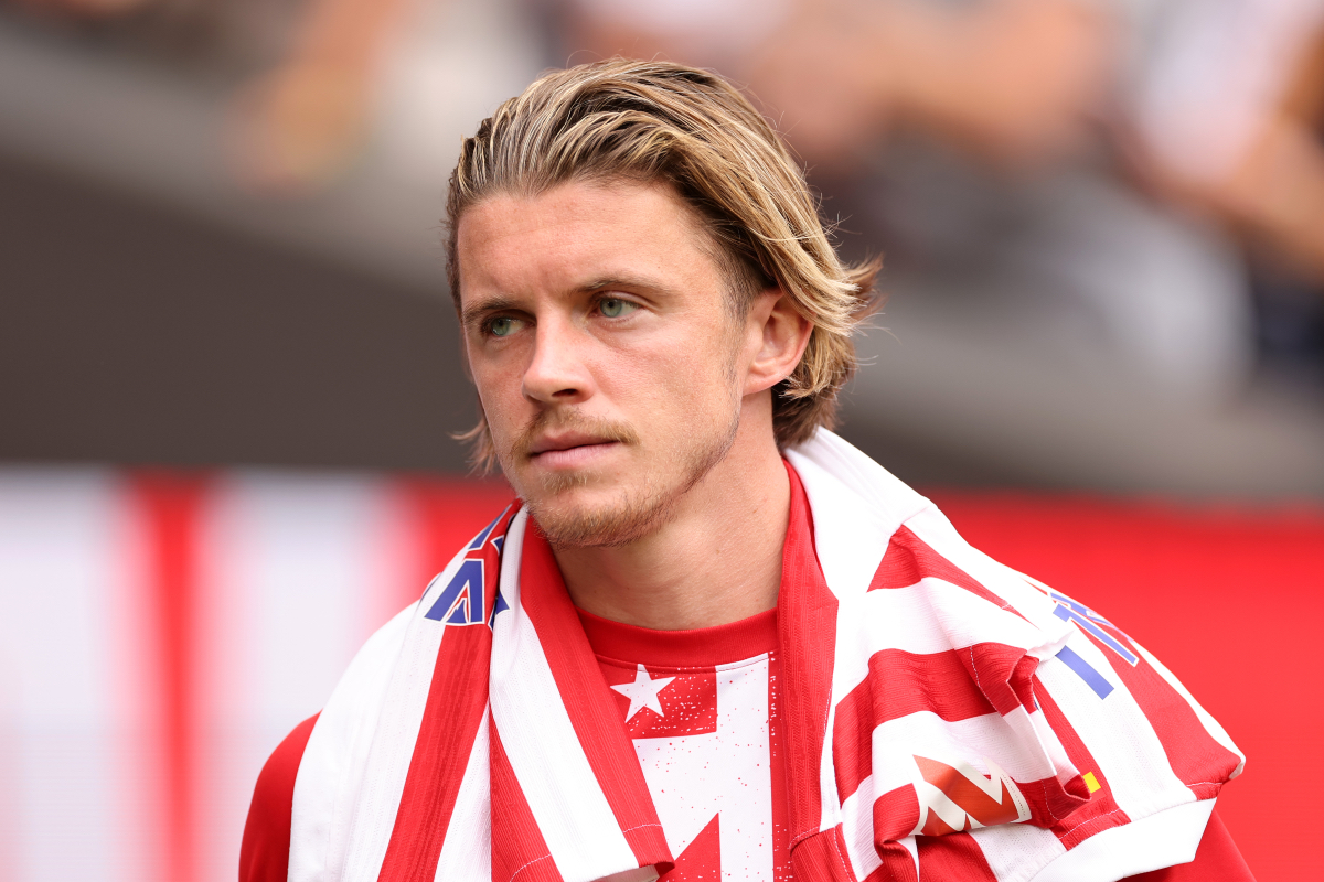 Conor Gallagher looks on while warming up for Atletico Madrid.