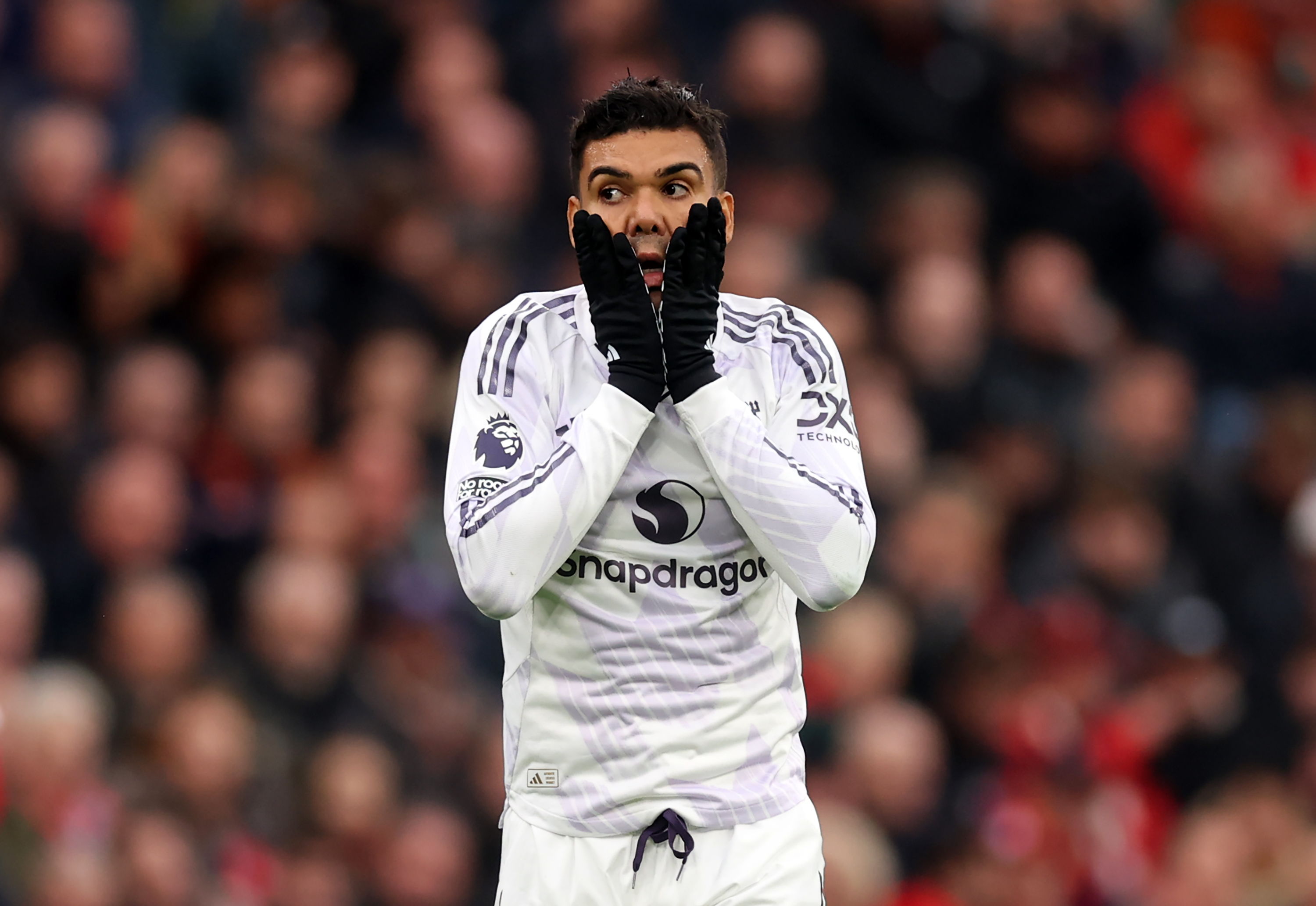 Casemiro reacts while in action for Man United against Liverpool.
