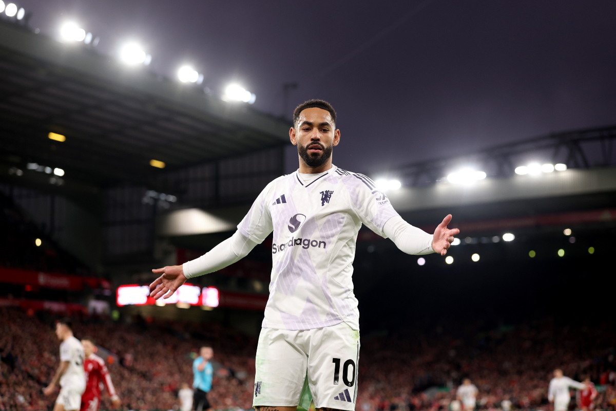 Matheus Cunha waits for a ball to take a throw-in at Anfield.