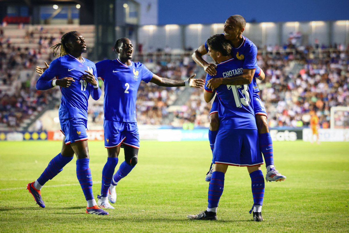 Castello Lukeba celebrates with teammates